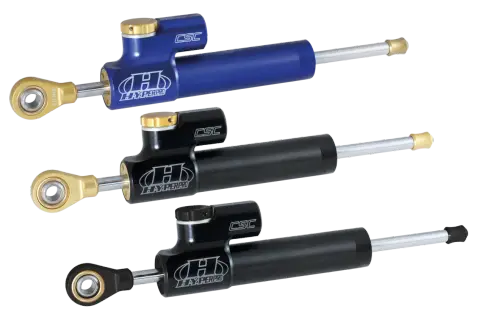 Tre ammortizzatori Hyperpro CSC, uno blu e due neri, perfetti per migliorare la stabilità delle Harley Davidson.
